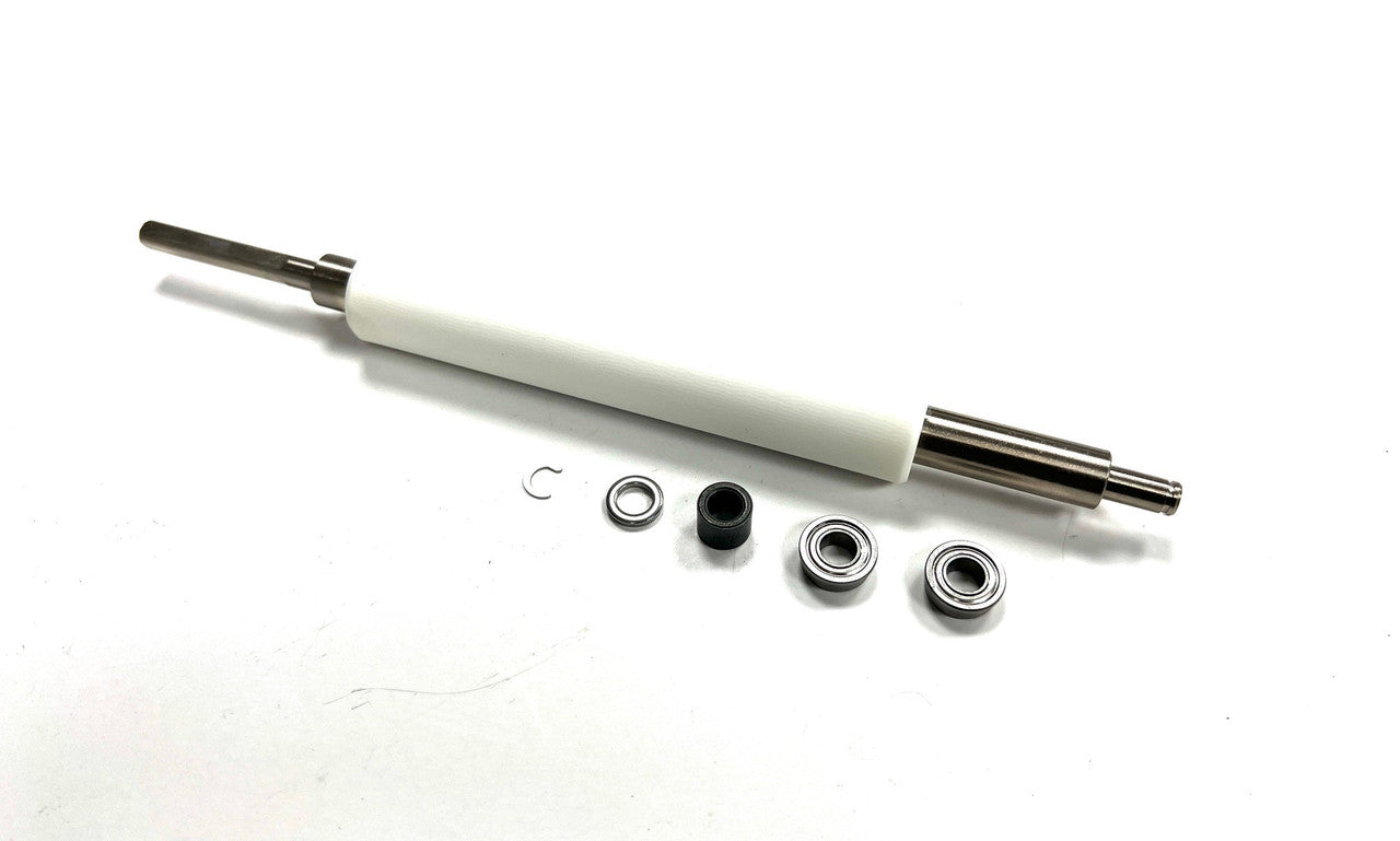 WHITE ZEBRA PLATEN ROLLER WITH FOUR METALIC AND ONE PLASTIC PIECES NEXT TO IT ON A WHITE BACKGROUND