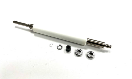 WHITE ZEBRA PLATEN ROLLER WITH FOUR METALIC AND ONE PLASTIC PIECES NEXT TO IT ON A WHITE BACKGROUND