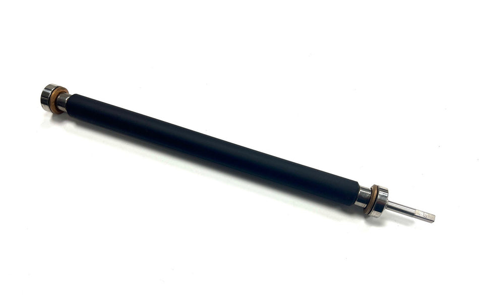 Black mechanical component with metal ends on a white background