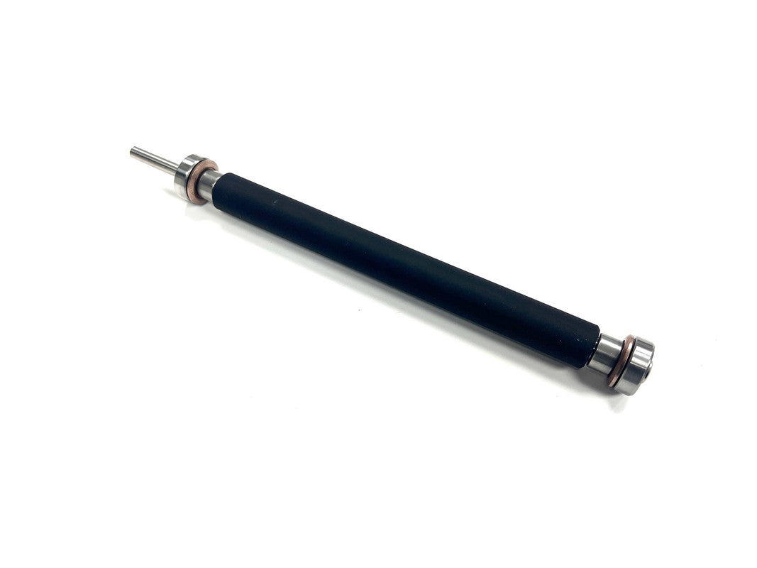 Black cylindrical object with metallic ends on a white background
