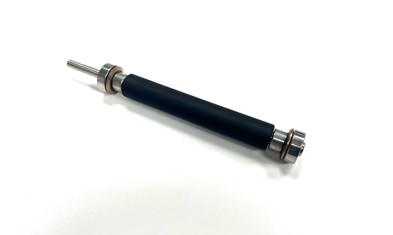 Black cylindrical object with metallic ends on a white background
