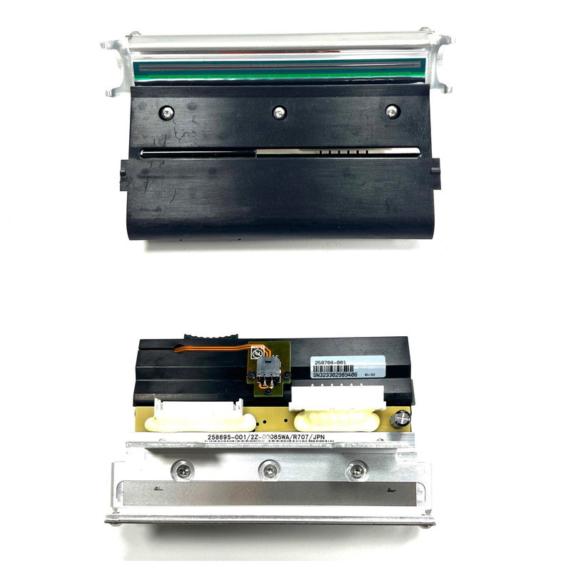 Close-up of a printer head and ribbon on a white background