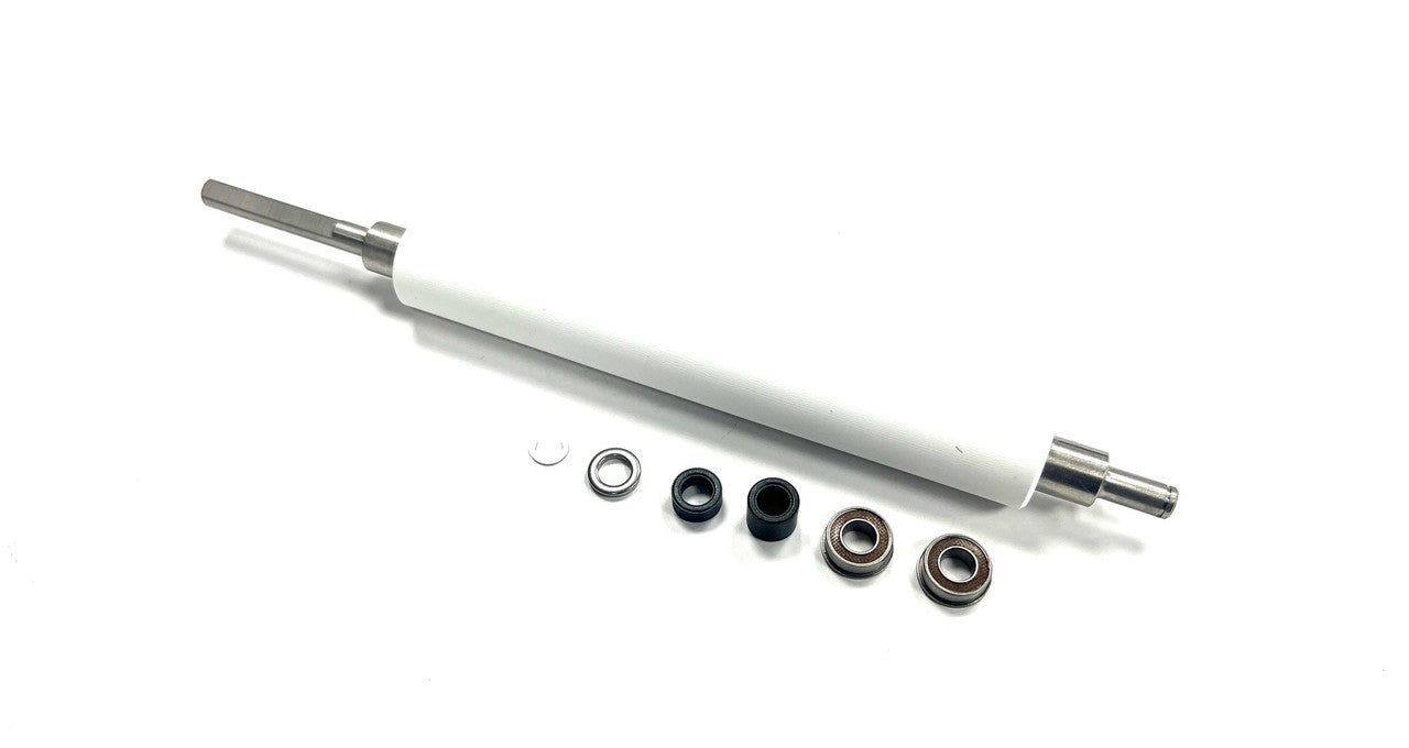 A white platen roller for Zebra printers accompanied by several small metal components.